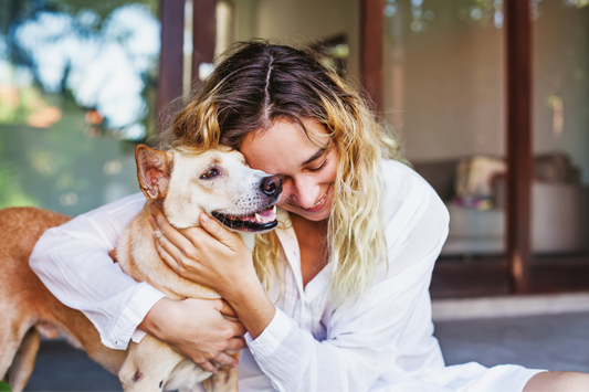 woman hugging her dog